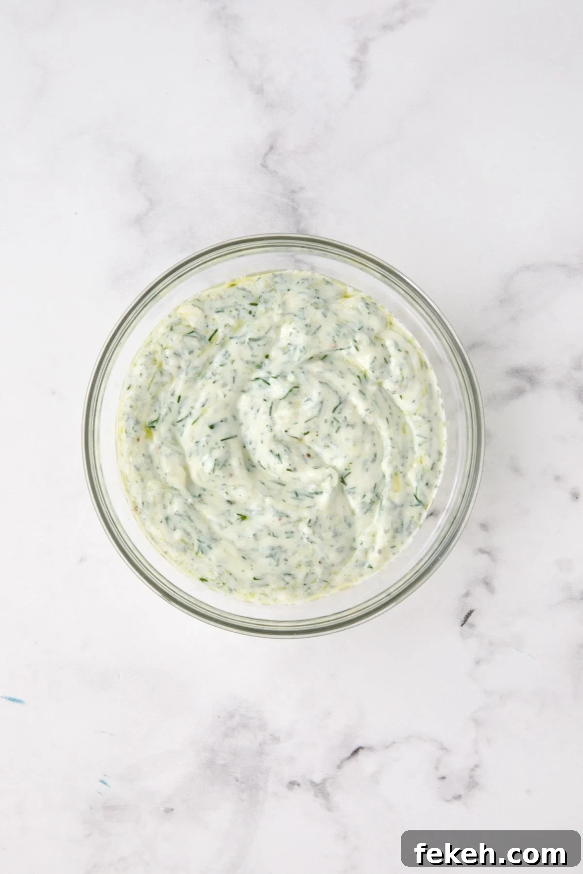 Mediterranean Grilled Zucchini with Dill Yogurt & Feta 5 Dill yogurt in glass bowl.