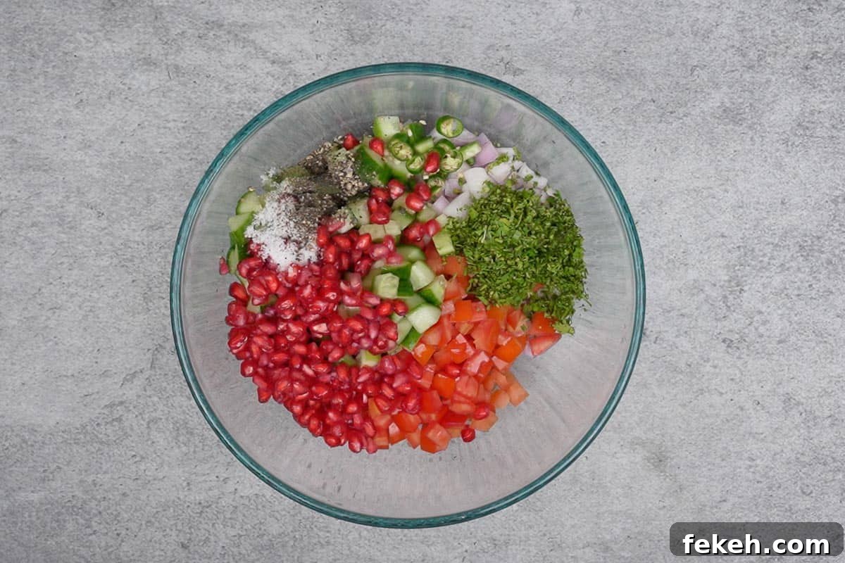 Fresh Kachumber Salad Recipe: Indian Cucumber Tomato Salad Guide 4 All the ingredients added to a bowl.