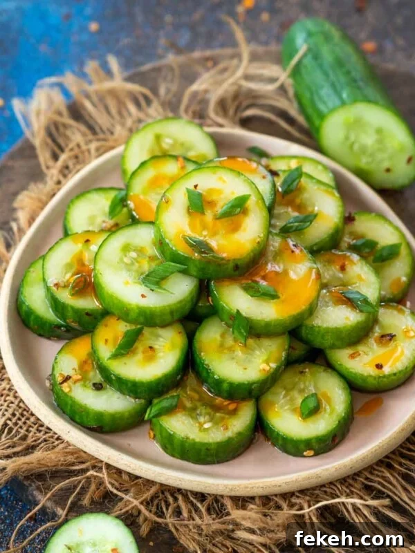 Fresh Kachumber Salad Recipe: Indian Cucumber Tomato Salad Guide 9 Din Tai Fung cucumber salad served on a plate.