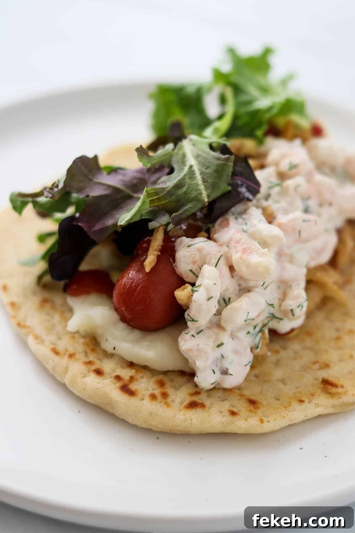 Traditional tunnsbrödrulle on a plate.