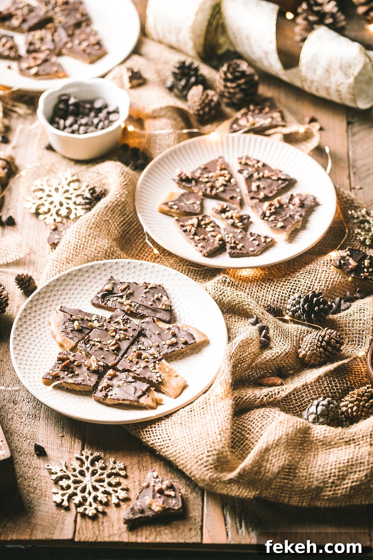 plate of golden English toffee surrounded by ingredients, vintage ornaments, and gold christmas decor