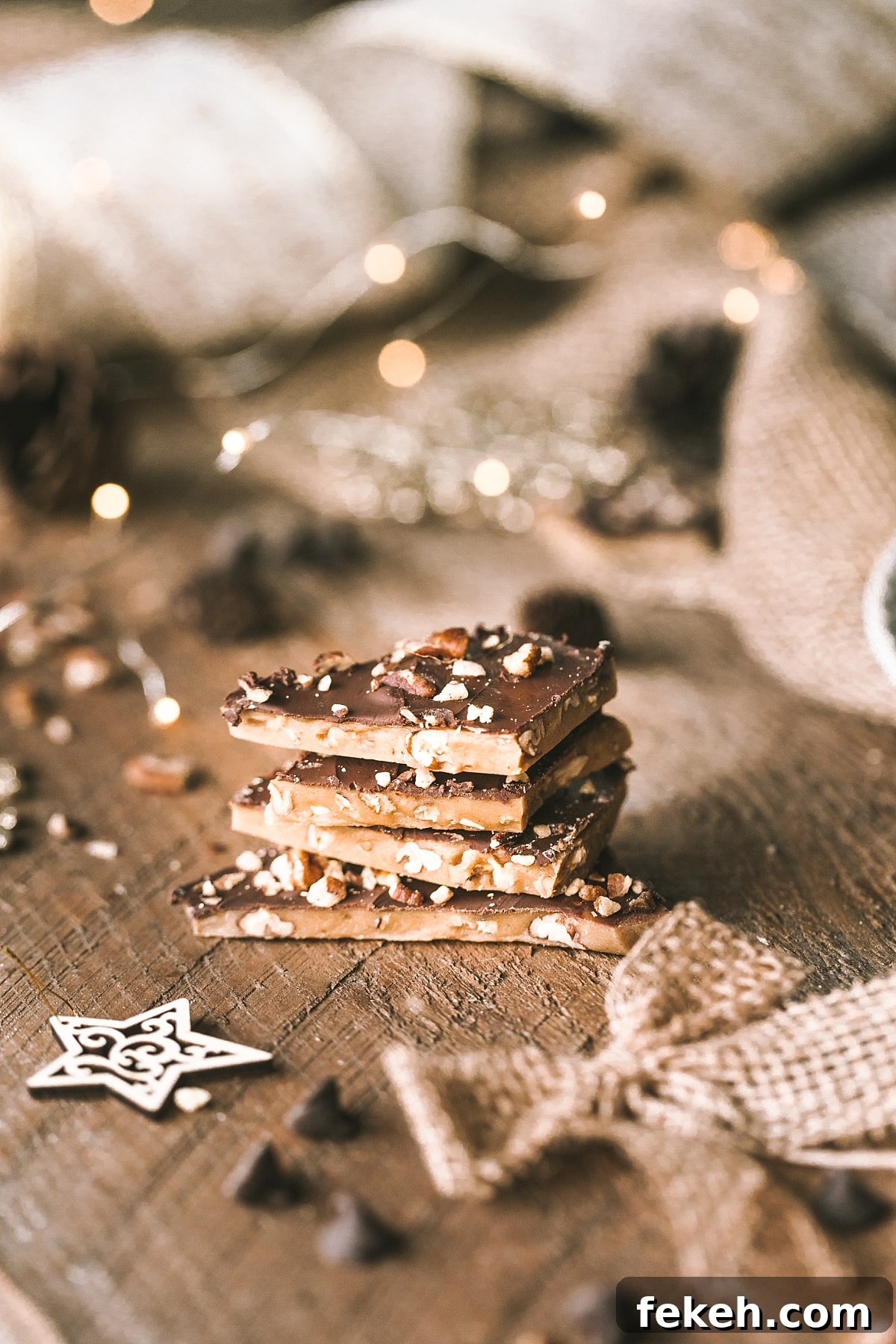 "star shot" of stack of rich buttery English toffee studded with almonds and covered with toasted pecans