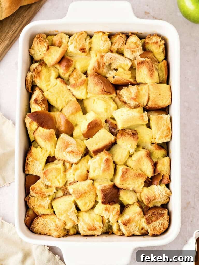 Rectangular white dish with baked bread pudding. Top view.