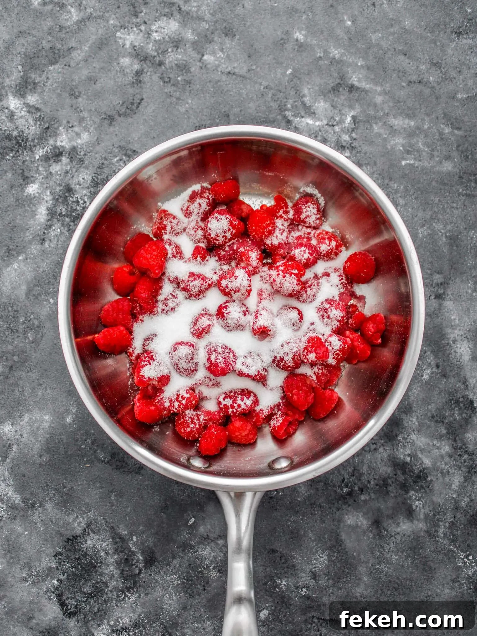raspberries and sugar in pan