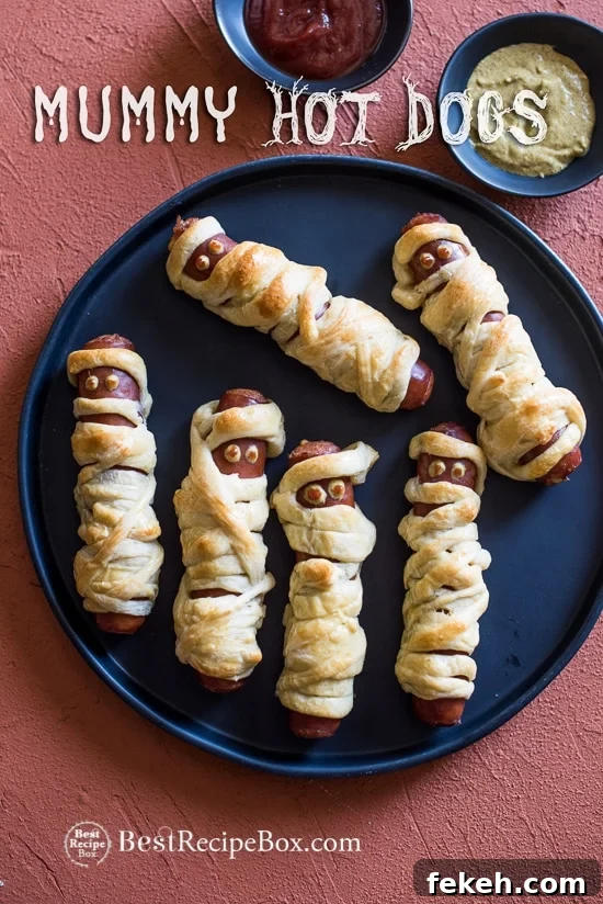 Halloween Mummy Hot Dogs Recipe on a plate 