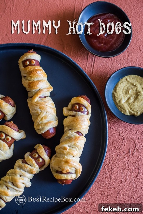 Halloween Mummy Hot Dogs Recipe on a plate 
