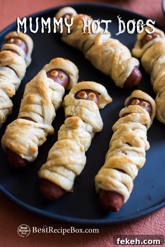 Halloween Mummy Hot Dogs Recipe on a plate 