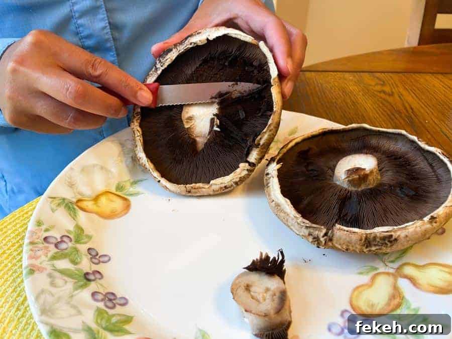 Cutting gils off of Portobello mushroom