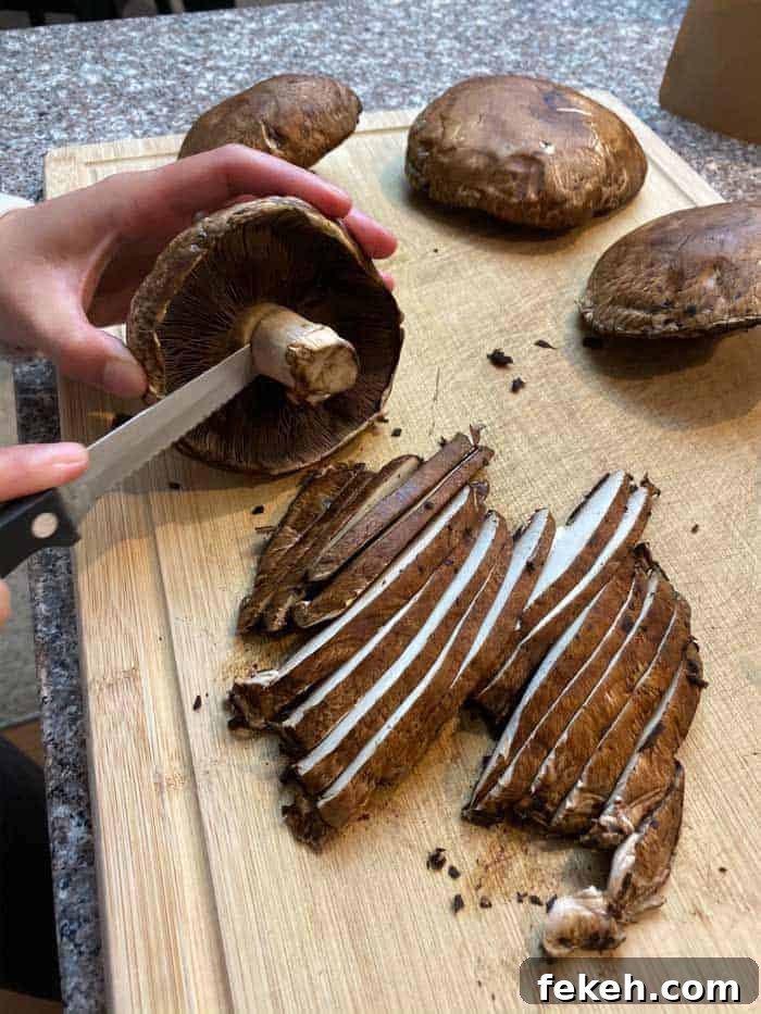 Sliced mushrooms on wooden cutting board