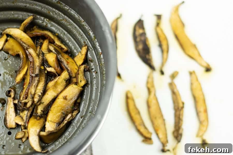 mushrooms slices in colander and paper towel