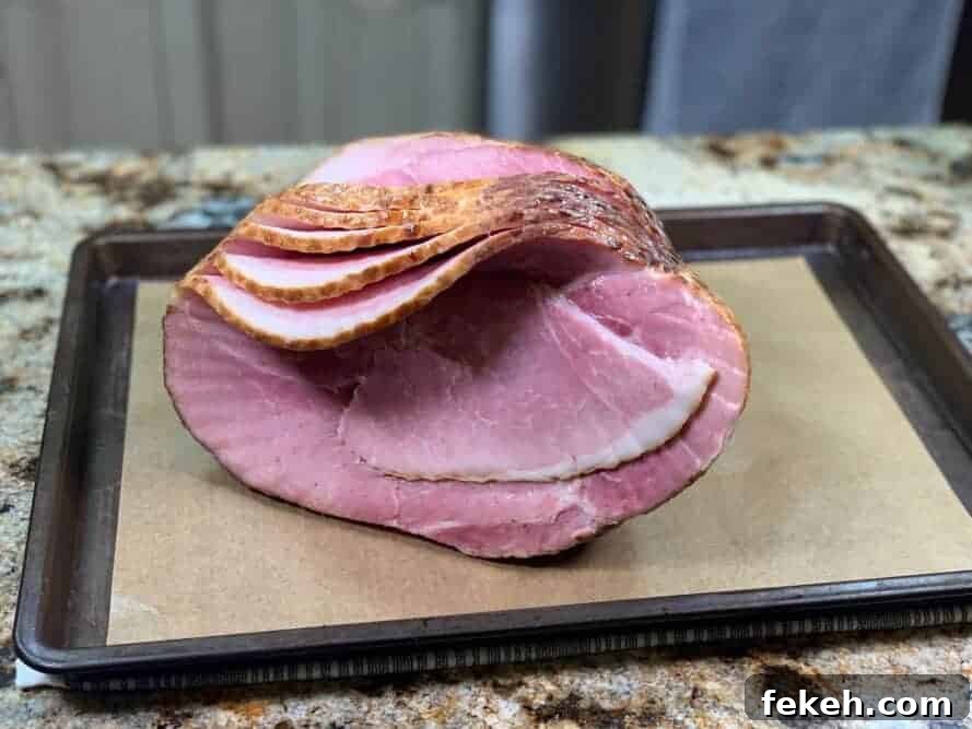 Ham being brushed with maple syrup