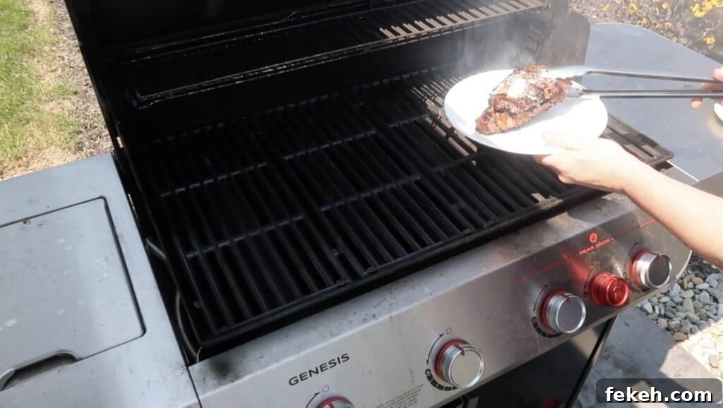 Removing steak from grill to a plate