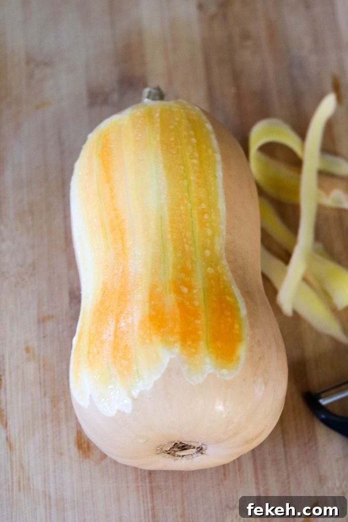 peeling butternut squash for Chicken Schnitzel kale autumn salad 