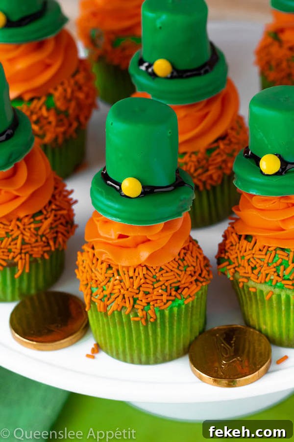 These Leprechaun Hat Cupcakes are super adorable and fun to make! A moist green vanilla cupcake stuffed with gold sprinkles, topped with a fluffy green and orange vanilla frosting and a cute little leprechaun hat sitting on top! This is the ultimate St. Patrick’s Day treat!