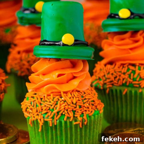 These Leprechaun Hat Cupcakes are super adorable and fun to make! A moist green vanilla cupcake stuffed with gold sprinkles, topped with a fluffy green and orange vanilla frosting and a cute little leprechaun hat sitting on top! This is the ultimate St. Patrick’s Day treat!