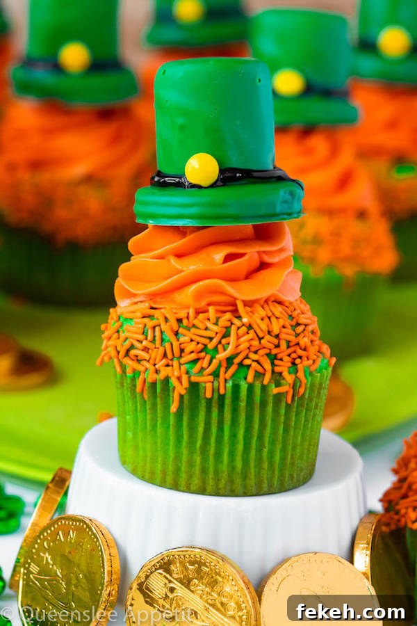 These Leprechaun Hat Cupcakes are super adorable and fun to make! A moist green vanilla cupcake stuffed with gold sprinkles, topped with a fluffy green and orange vanilla frosting and a cute little leprechaun hat sitting on top! This is the ultimate St. Patrick’s Day treat!