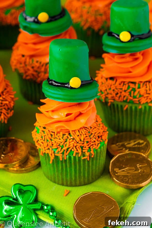 These Leprechaun Hat Cupcakes are super adorable and fun to make! A moist green vanilla cupcake stuffed with gold sprinkles, topped with a fluffy green and orange vanilla frosting and a cute little leprechaun hat sitting on top! This is the ultimate St. Patrick’s Day treat!