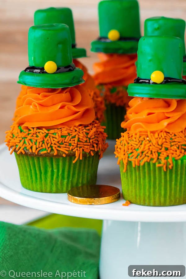 These Leprechaun Hat Cupcakes are super adorable and fun to make! A moist green vanilla cupcake stuffed with gold sprinkles, topped with a fluffy green and orange vanilla frosting and a cute little leprechaun hat sitting on top! This is the ultimate St. Patrick’s Day treat!