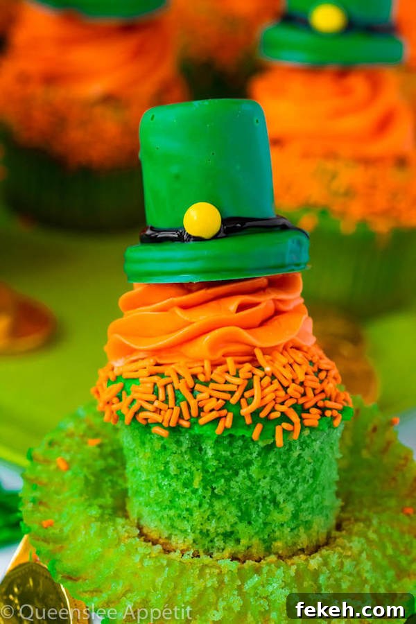 These Leprechaun Hat Cupcakes are super adorable and fun to make! A moist green vanilla cupcake stuffed with gold sprinkles, topped with a fluffy green and orange vanilla frosting and a cute little leprechaun hat sitting on top! This is the ultimate St. Patrick’s Day treat!