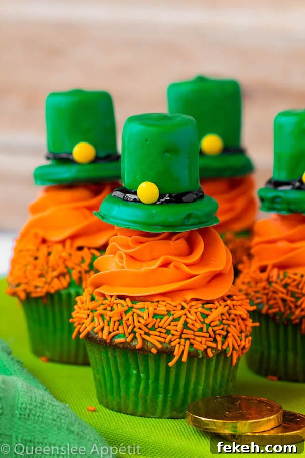 These Leprechaun Hat Cupcakes are super adorable and fun to make! A moist green vanilla cupcake stuffed with gold sprinkles, topped with a fluffy green and orange vanilla frosting and a cute little leprechaun hat sitting on top! This is the ultimate St. Patrick’s Day treat!
