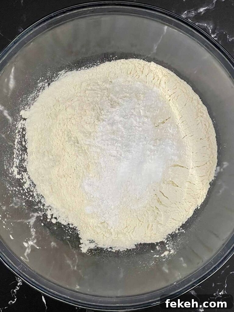 Dry ingredients in a glass mixing bowl.